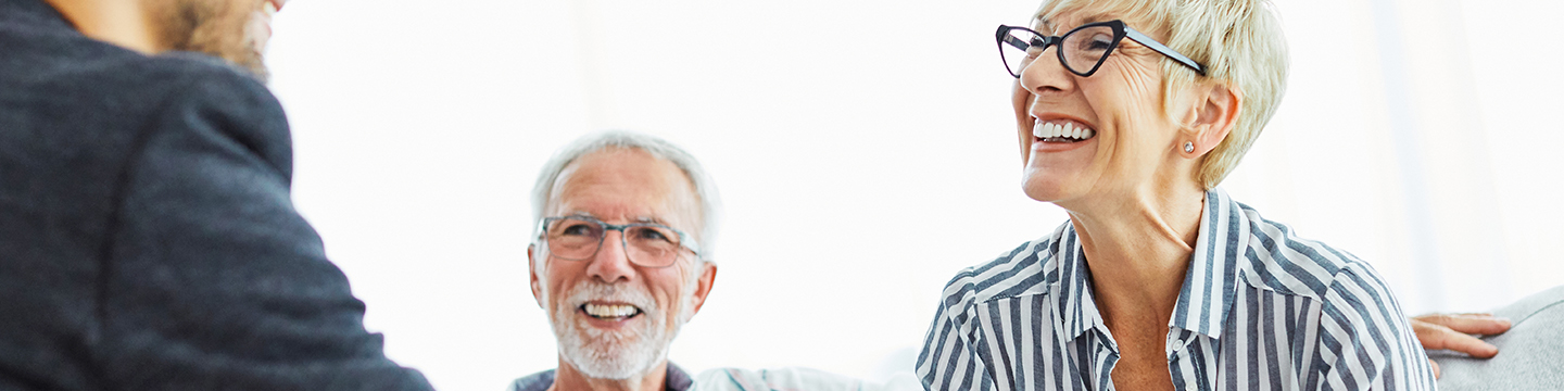 Couple speaking with a financial representative