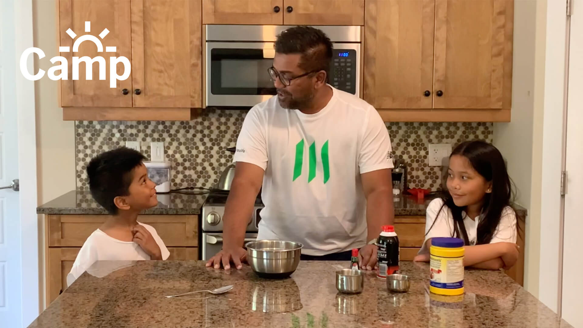 A Manulife employee and his children participating in Camp John Hancock activities