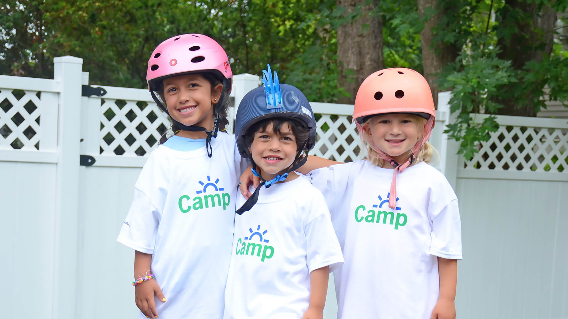 Kids participating in Camp John Hancock activities wearing their camp t-shirts.