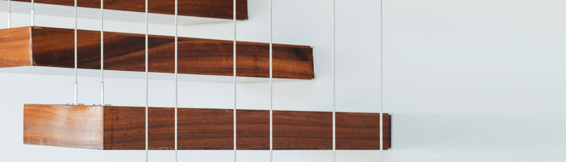 Floating wooden stairs being suspended by wires