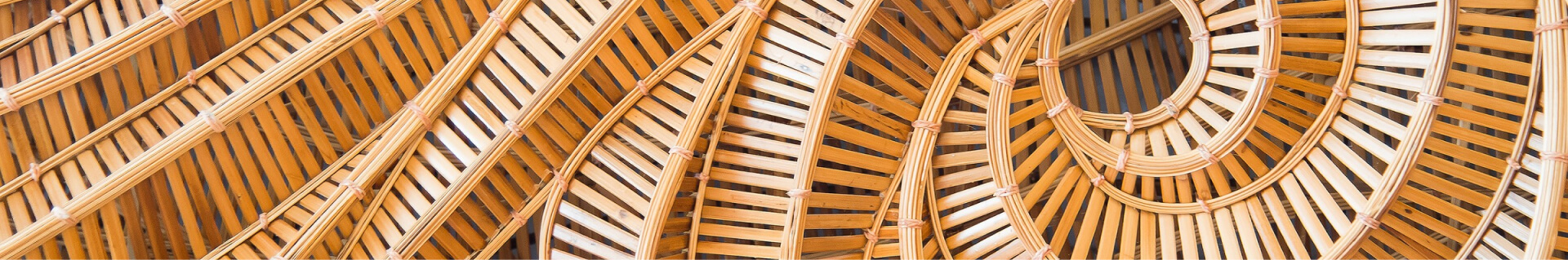 Overhead view of pieces of wood woven together in a circular pattern