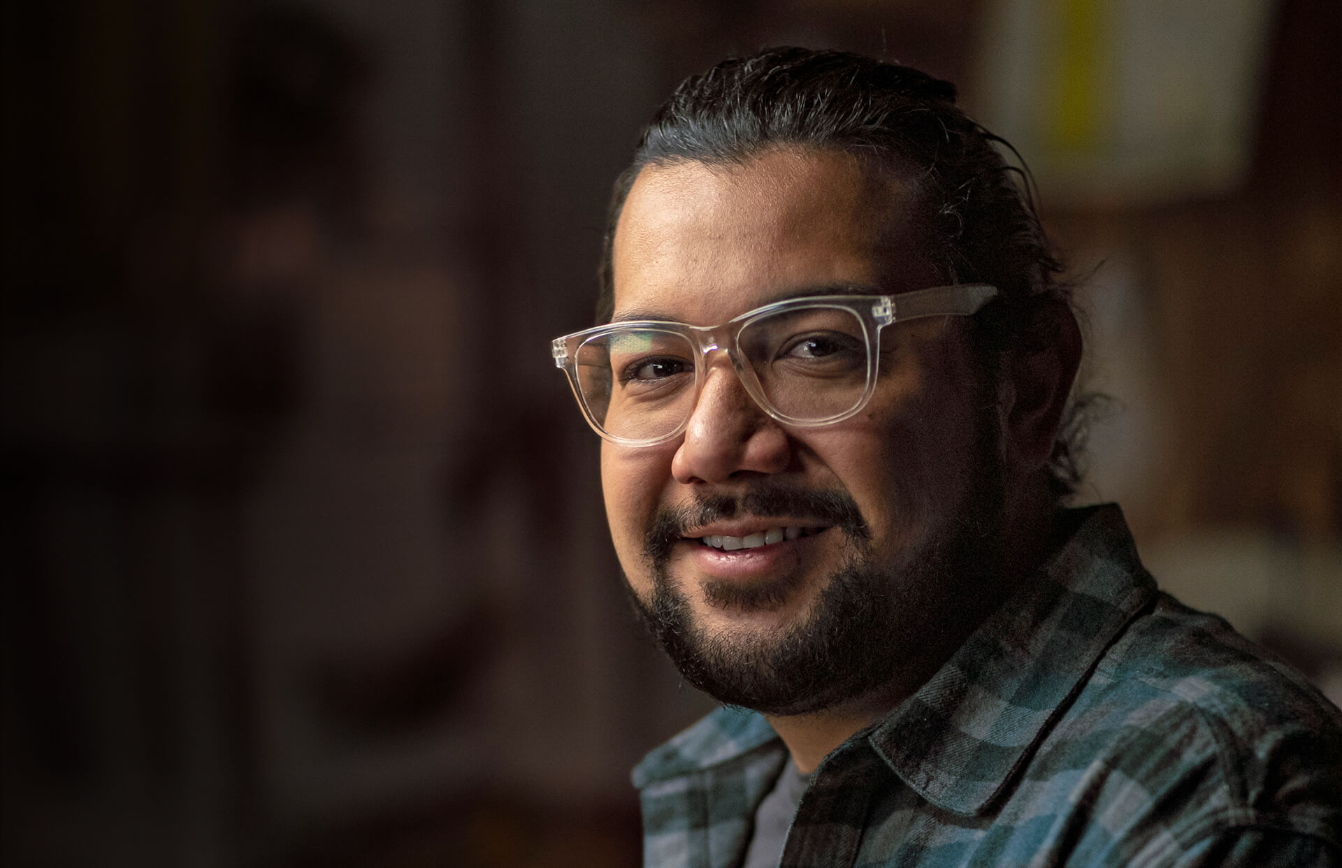 Portrait of a woodworker in his studio 