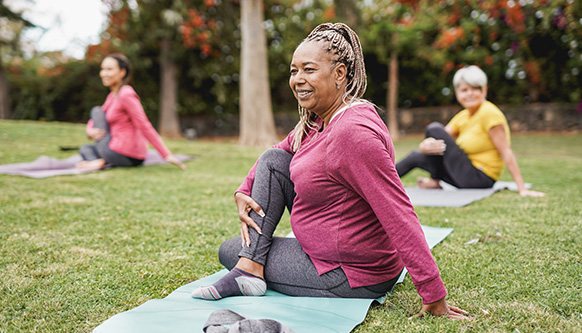 woman stretching back on mat