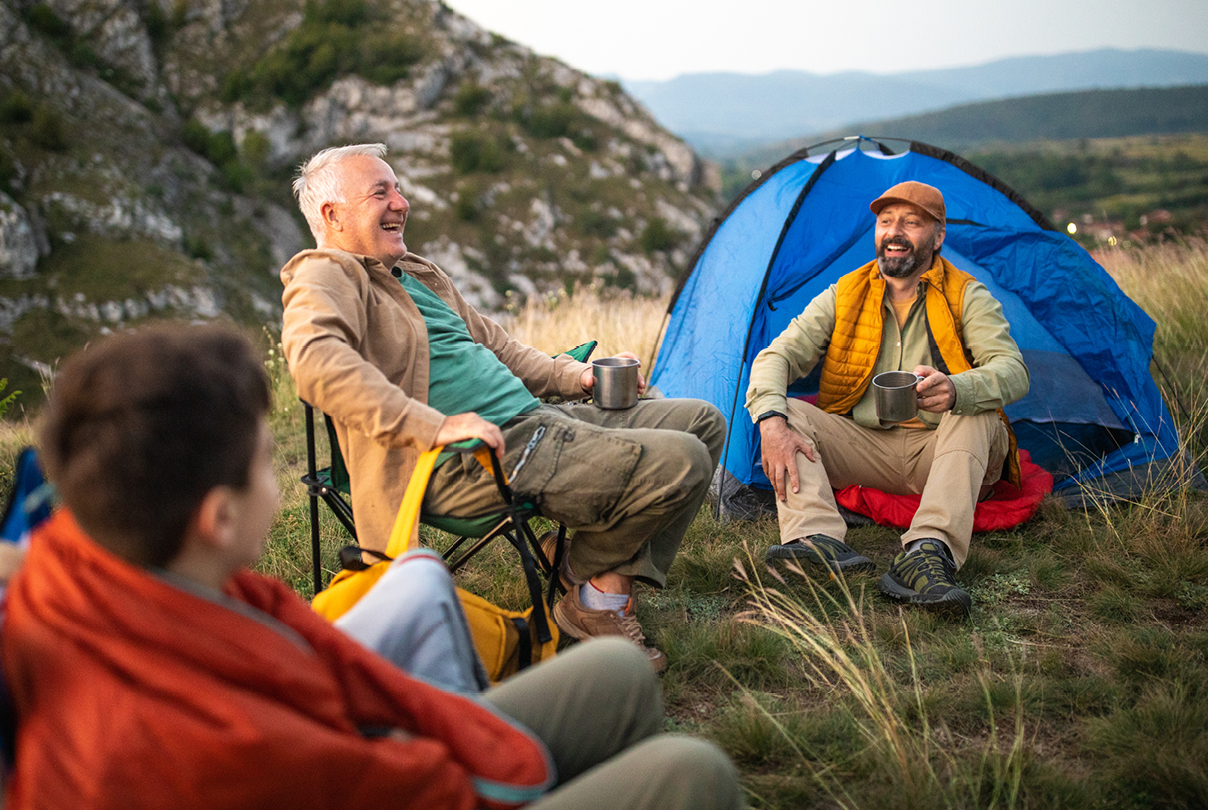 Group camping outdoors, symbolizing planning for long-term care and support in aging and caregiving roles.